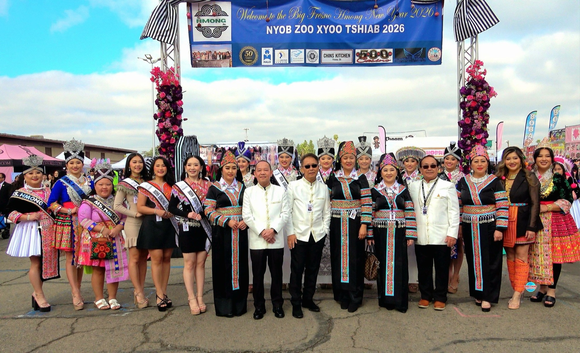 Civic leaders and titleholders gathered beneath the welcome arch at the Big Fresno Hmong New Year.