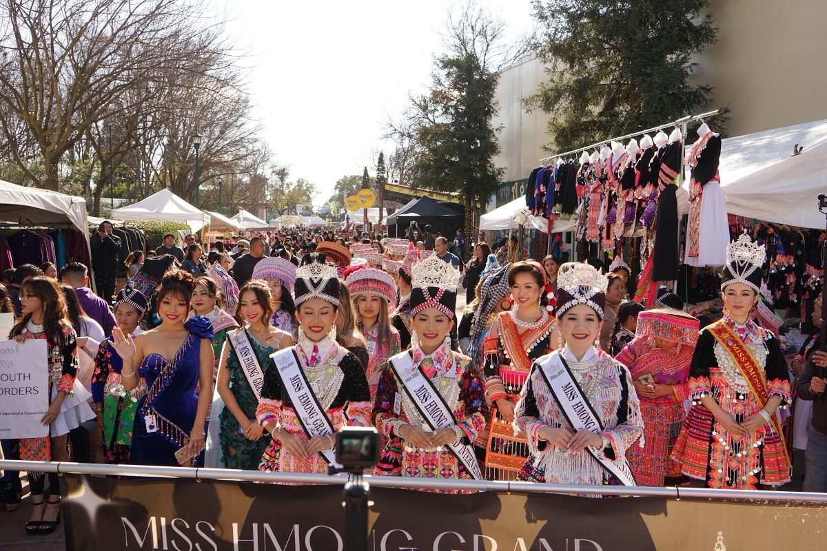 Shoppers filling the marketplace lanes between vendor stalls at the Big Fresno Hmong New Year.
