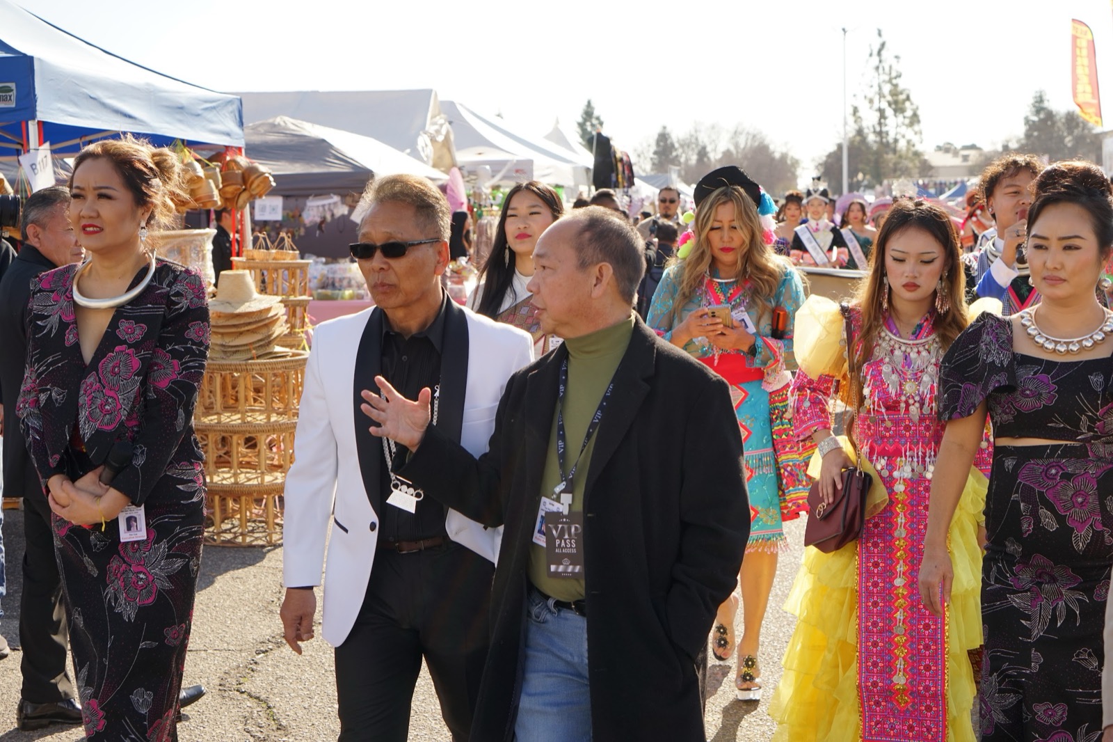 Shoppers and vendors in the festival marketplace.
