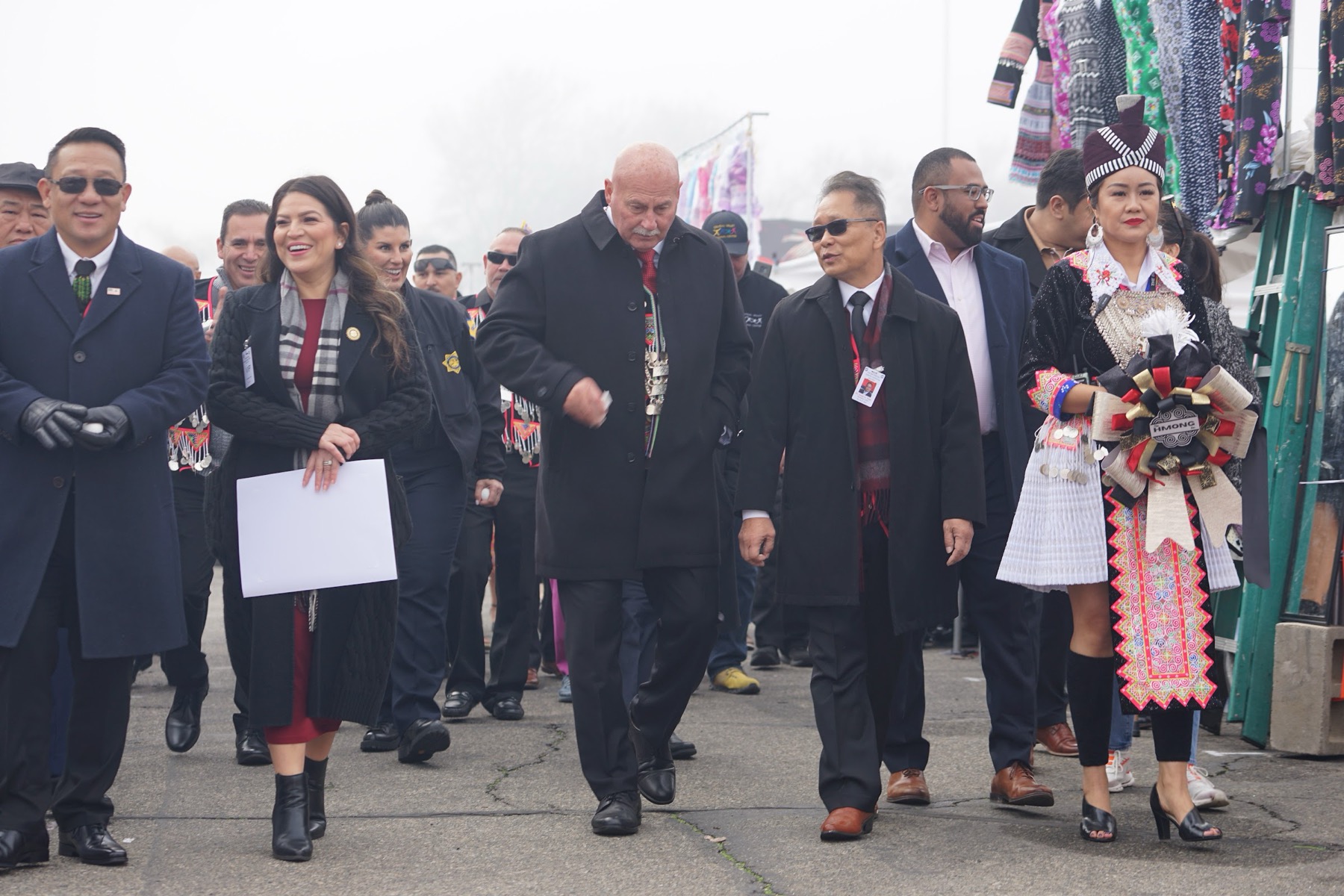 Board members and civic officials walking in together on opening morning at the Fresno Fairgrounds.